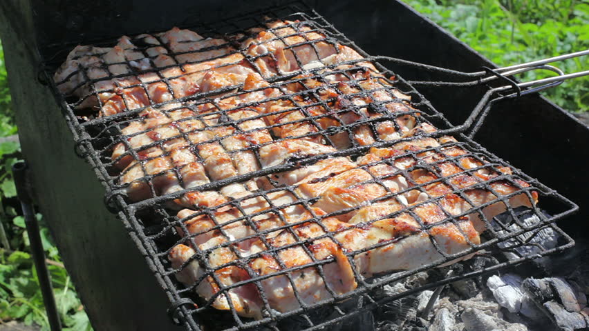 Cooking kebabs on the coals