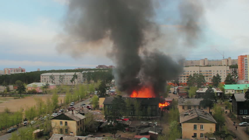 Wooden residential house in fire. Russia