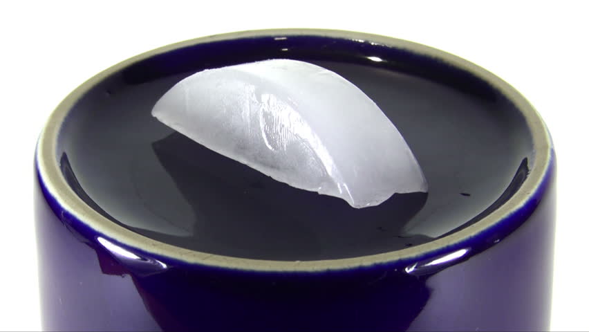 Ice Cube melting away. Time lapse. Quick time lapse of this single ice cube melting away.