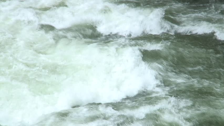 1080i, not rendered: Little rafting boat and kajak passing the rapids of a whitewater river. Noguera Pallaresa - Pyrenees - Spain. Tripod