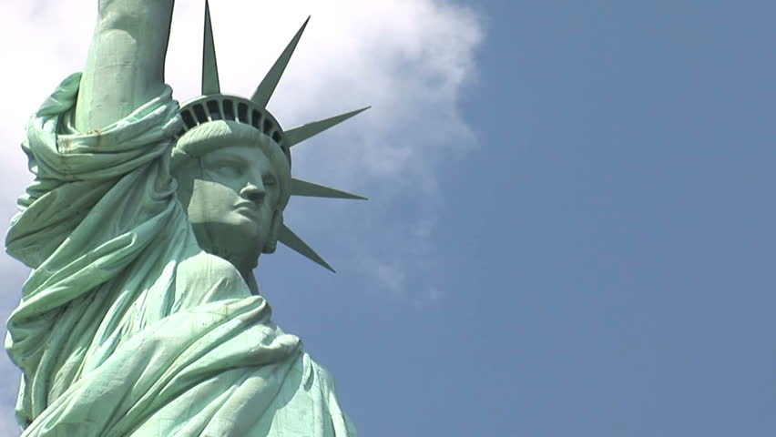 New York - MAY 16 2009: Tourists are starting to return to popular vacation spots like the Statue of Liberty after the world wide recession starts showing signs of recovery. 