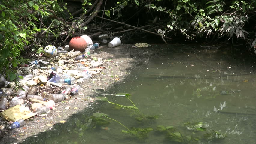 Video of the San Antonio River in Texas. Slow flow of water and lots of trash and junk. Water pollution and filth. Disgrace to society. Don Despain of Rekindle Photo