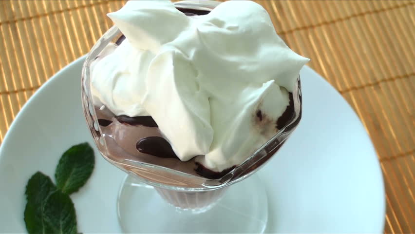 1920x1080 Nuts sprinkled on whipped cream, hot fudge sundae.