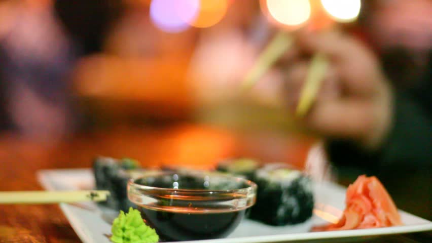 Sushi dip in sauce 