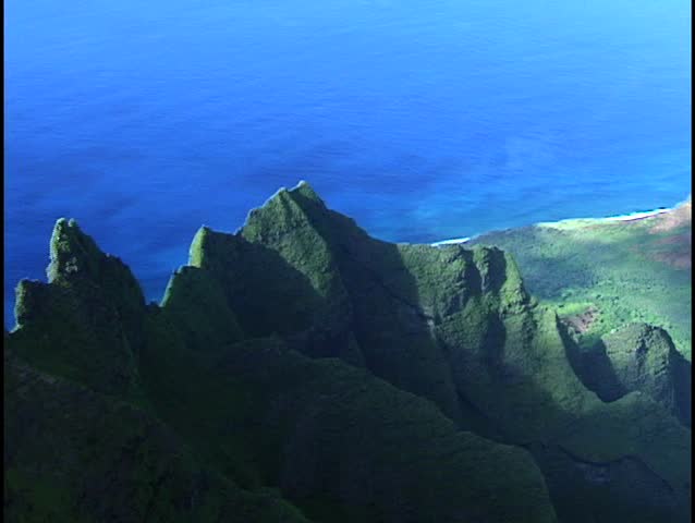 Razor edge cliffs like this one are difficult to film because they are only approachable by helicopter. This area in Hawaii is commonly refered to as the spires.