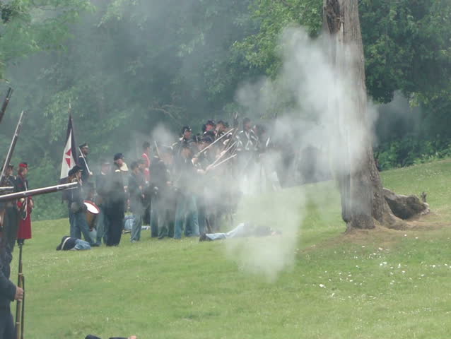 PORT GAMBLE, WA - JUN 20 2009: Civil War reenactors participate in a mock battle.	Union infantry line fires volleys at the enemy 