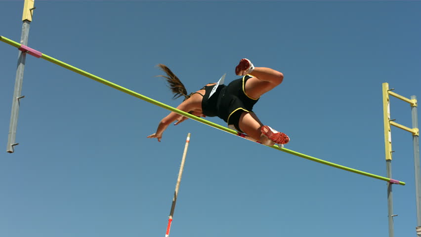 Track and Field athlete doing pole vault, slow motion