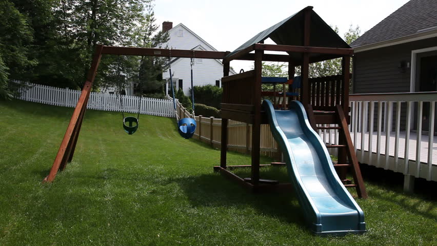 Empty swings on a jungle gym 