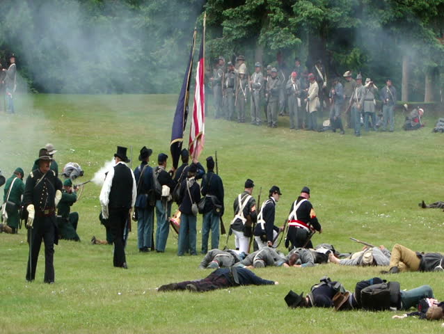 PORT GAMBLE, WA - JUN 20 - Civil War reenactors participate in a mock battle at Port Gamble WA on Jun 20, 2009.	Union and Confederate infantry trade fire. 