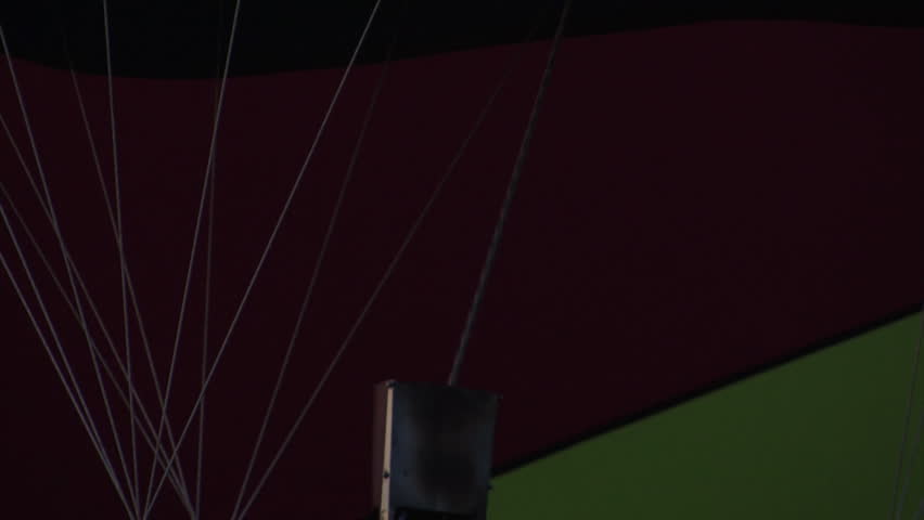 A hot air balloon gets inflated by propane gas.