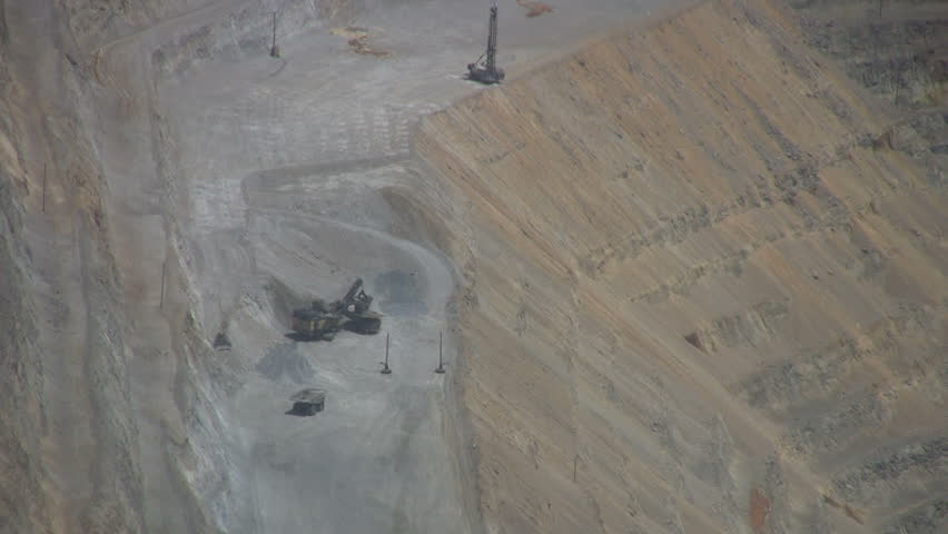 Video Kennecott Copper Mine central Utah. Zoom out. Butterfield Canyon Ophir Mountains near Salt Lake City. Mountain top forest around open pit mine.  Don Despain of Rekindle Photo.