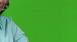 Young business woman talking on headset - slow zoom out - green screen version