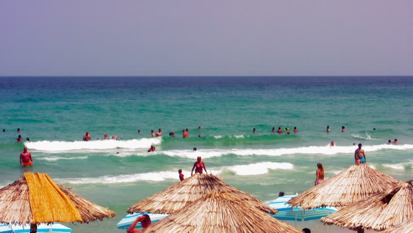 People enjoying the sea waves 14