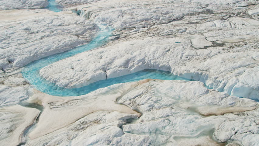 Aerial view of moraine covered ice slabs from Knik Glacier feeding the Knik River which empties Cook Inlet, Alaska, USA shot on RED EPIC. 4K, UHD, Ultra HD, resolution
