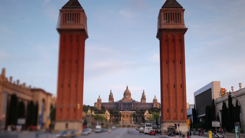rush of traffic early evening, at plaza de espana, barcelona, spain