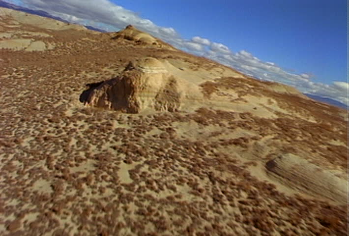 Flying above rocky hillsides in the Sierra Nevada Mountain Range.