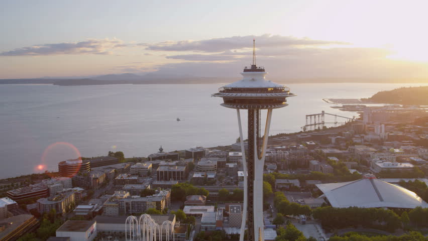 Seattle - July 2013: Aerial close up sun flare view at sunset Seattle Space Needle Elliot Bay, Puget Sound, Washington State, Pacific Northwest, USA, RED EPIC, 4K, UHD, Ultra HD resolution
