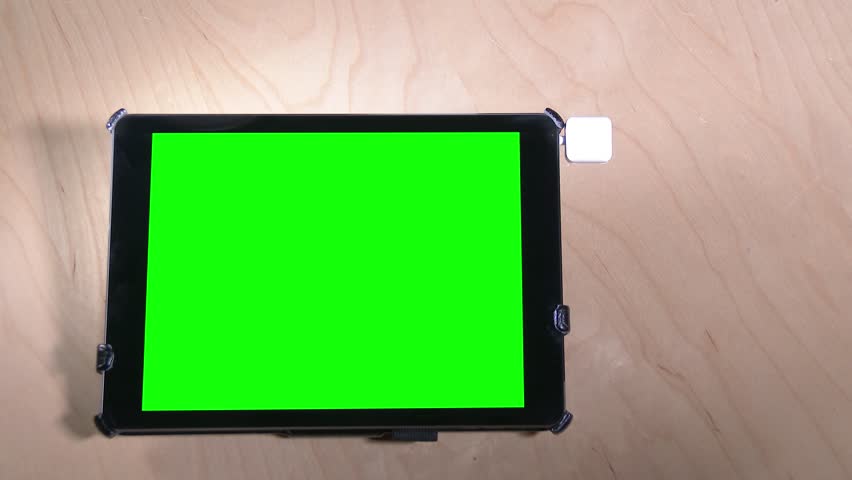 Swiping a fictional credit card on a green screen tablet PC. With optional luma matte.