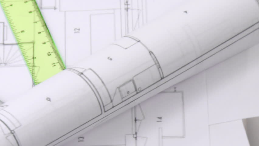 High angle of plans and blueprints turning