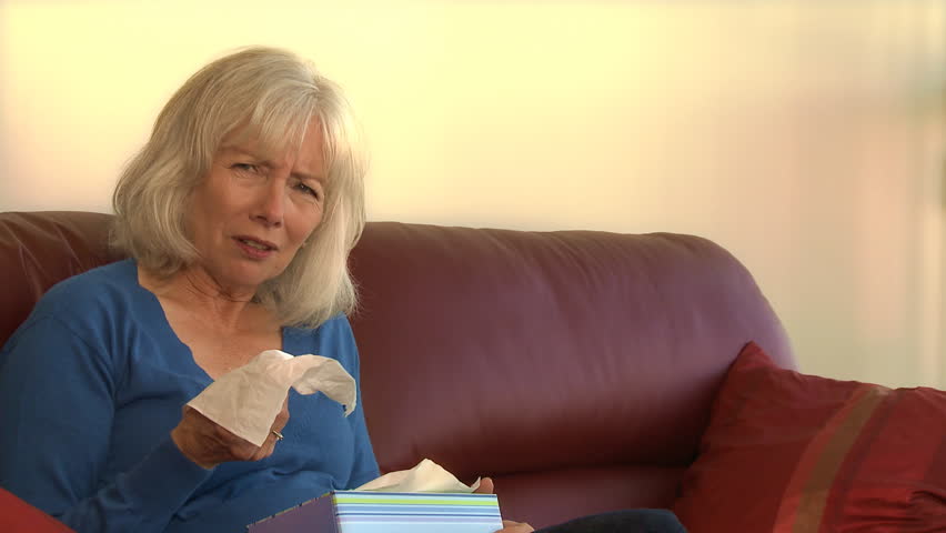 senior woman sick with the flu