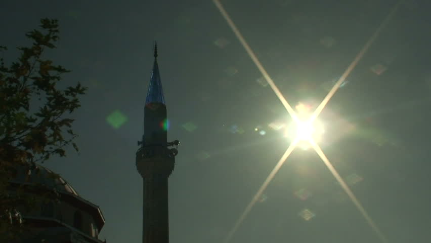 Sunlight behind minaret on Turkish Mosque