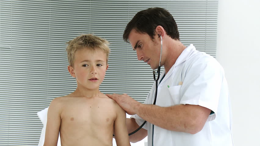 Doctor listening to a child with stethoscope