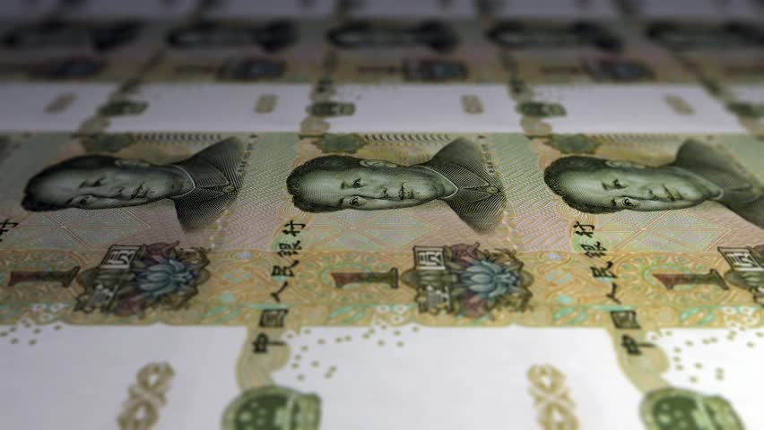 Seamless looping high definition video of 100 Chinese Yuan bills in uncut sheets being printed.  Shallow depth of field. 