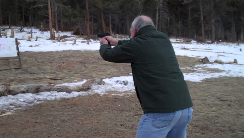 senior citizen practicing firearm self-defense on the range