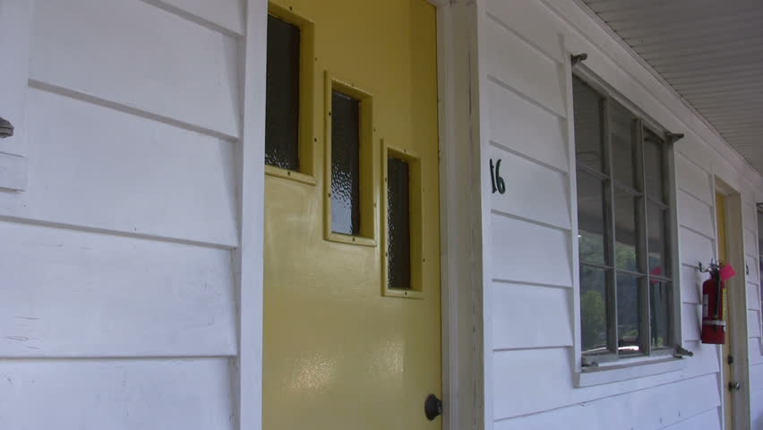Motel Rooms with people outside