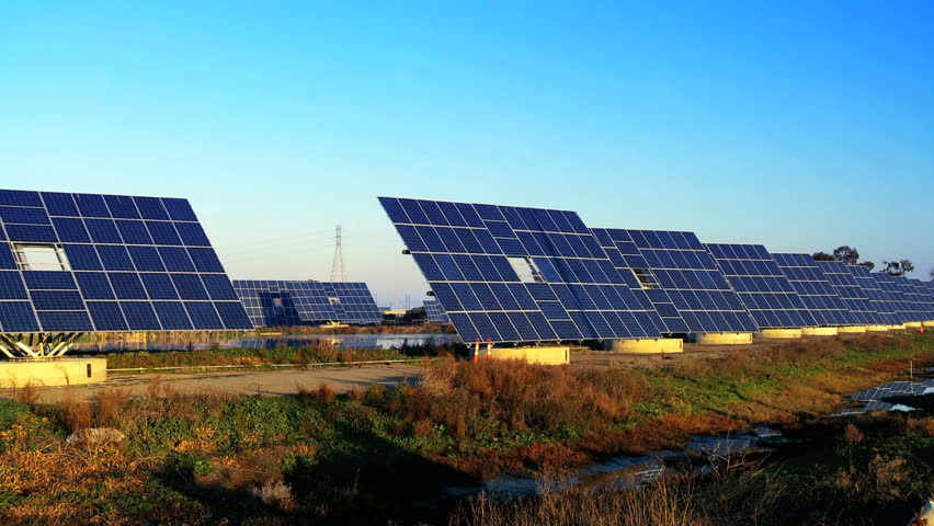 Farms of photovoltaic solar panels producing clean sustainable energy