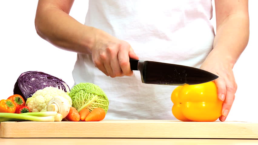 Delicious fresh vegetables being chopped to provide ingredients for modern healthy lifestyle food