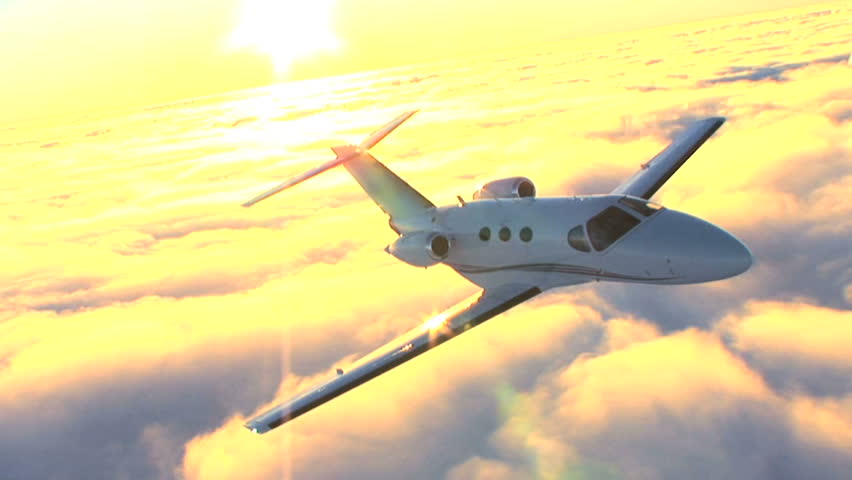 Air to air luxury corporate jet being used for modern business travel