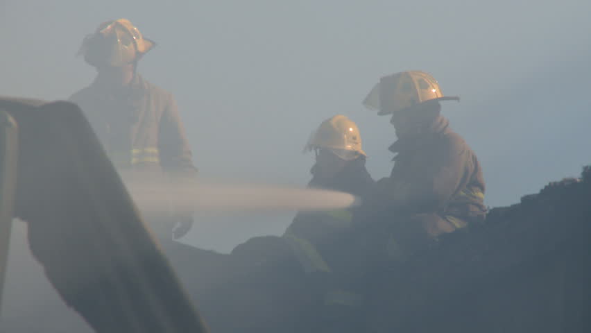 Fireman fighting fire in warehouse