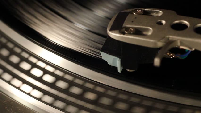 Needle on a spinning record player.