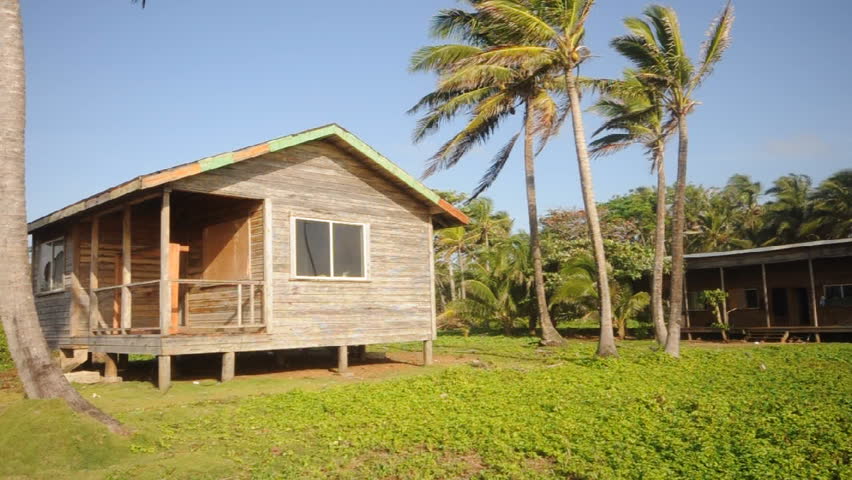 cabin Big Corn Island Nicaragua with coconut tree panned to fresh water swamp island water supply