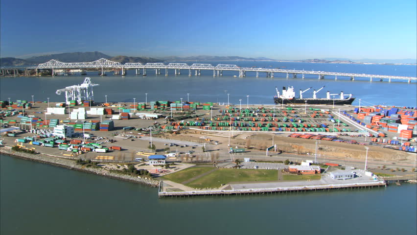 Low aerial view of a container port on San Francisco coastline