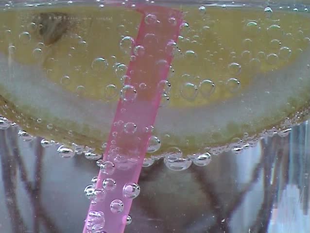 Fresh lemonade with bubbles, lemon refreshment background