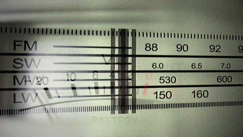 an analogue radio dial tuning in different radio frequencies