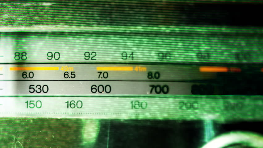 an analogue radio dial tuning in different radio frequencies