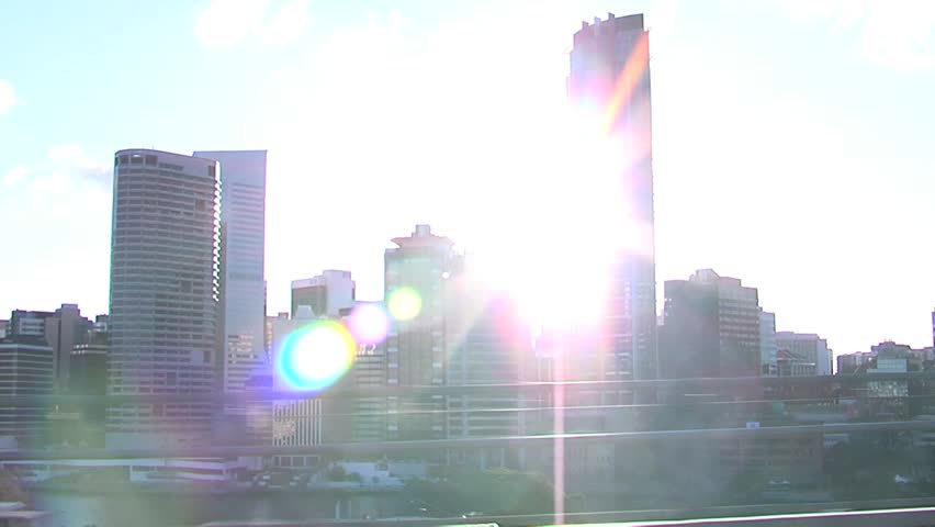 Hand held shot of city passing by, driving along a bridge.  HDV 720p, 30FPS