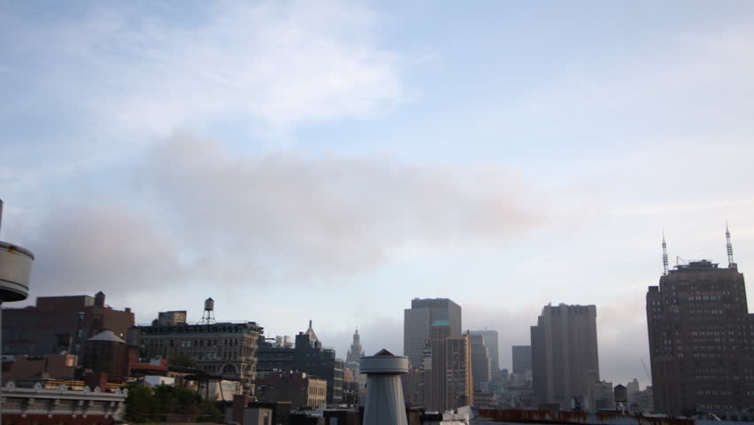 clouds moving across the sky from a new york rooftop
