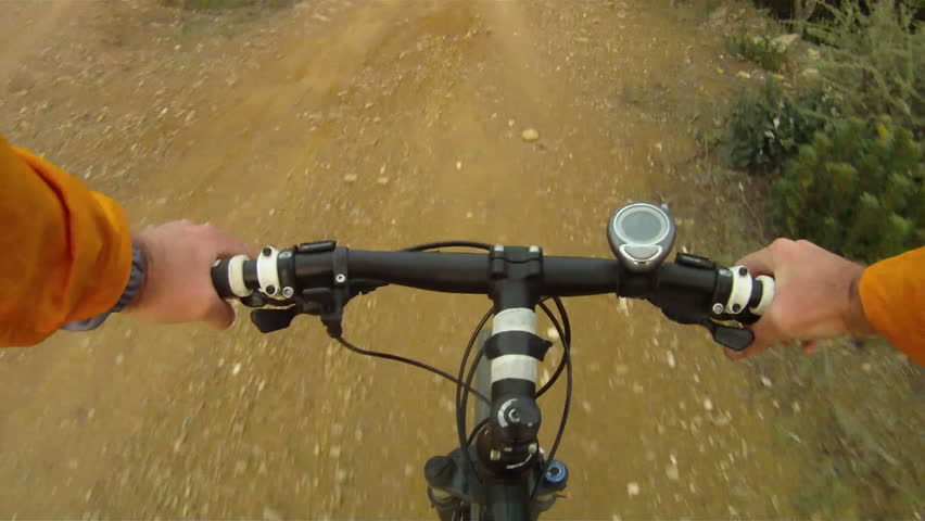 Mountain Bike traveling fast along dirt track