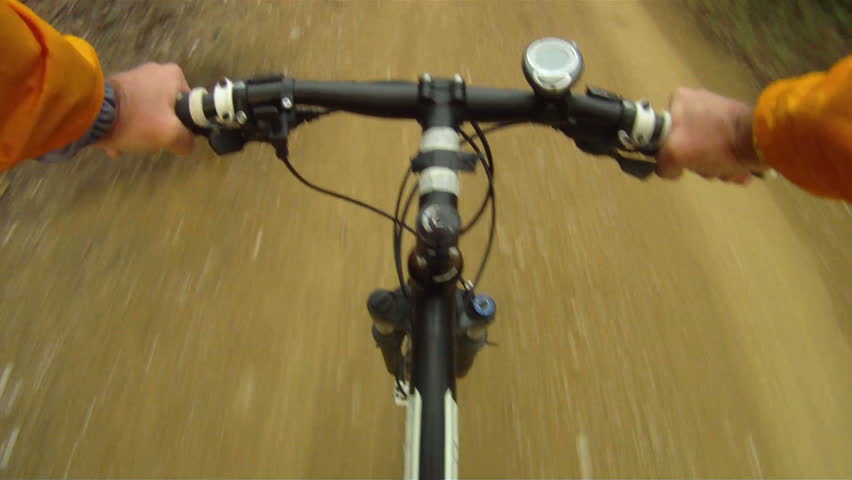Mountain Bike traveling fast along dirt track