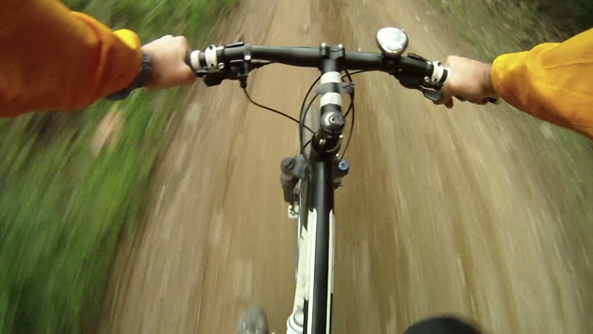 Mountain Bike traveling fast along dirt track
