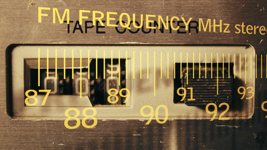 an analogue radio dial tuning in different radio frequencies