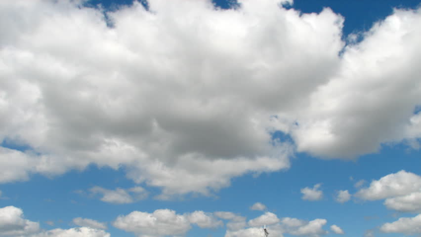 Time lapse sequence of morphing white clouds over a blue sky (France, west coast)