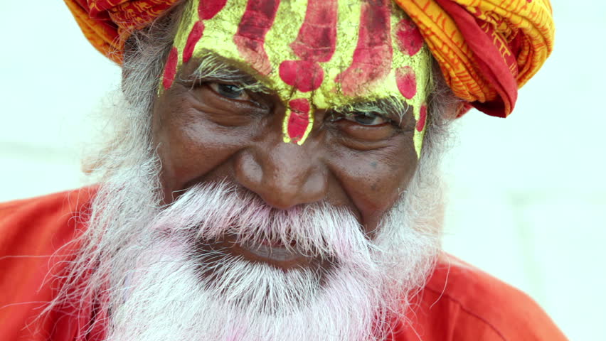 Sadhu at the ghats in Varanasi, India. With a pink beard from the traditional holi festival.