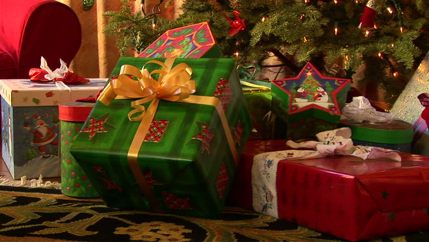 Close up of decorated Christmas tree with wrapped presents 