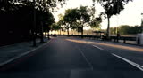 Point-of view driving through quiet city streets in early morning