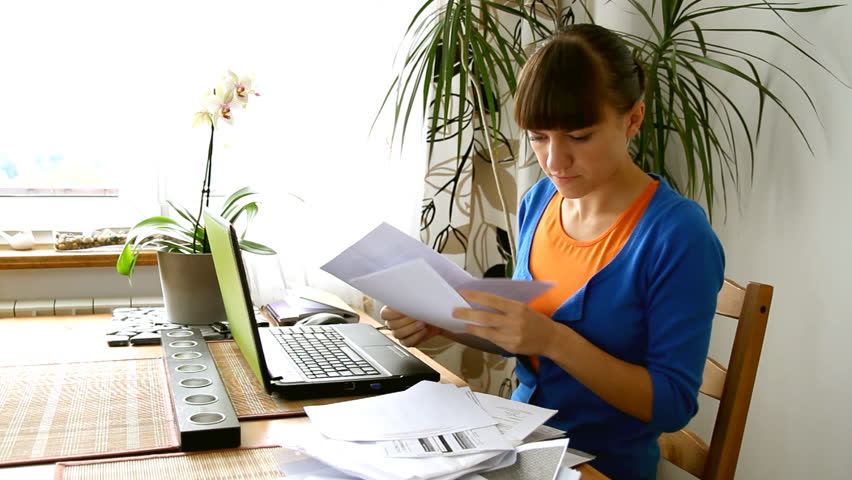 A young woman stressed because of bills